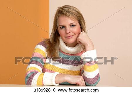 Portrait of young woman wearing striped turtleneck jumper, smiling View Large Photo Image Stock Image - Portrait of young woman wearing striped turtleneck jumper, smiling. Fotosearch