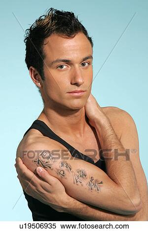 Young man in casual clothing, head and shoulders, studio shot View Large Photo Image Stock Photography - Young man in casual clothing, head and shoulders, studio shot. Fotosearch
