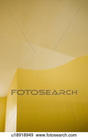 Stock Photo - Architectural details of ceiling and yellow walls. Fotosearch