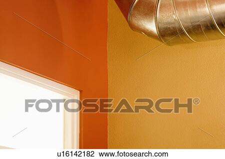 Stock Image - Brightly Colored Walls and Industrial Duct. Fotosearch