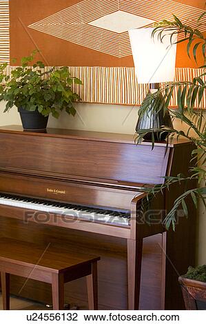 Brown contemporary piano and lamp View Large Photo Image Stock Image - Brown contemporary piano and lamp. Fotosearch