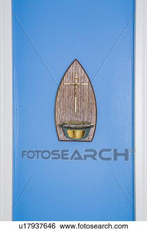 Stock Photograph - Cross on Blue Wall. Fotosearch