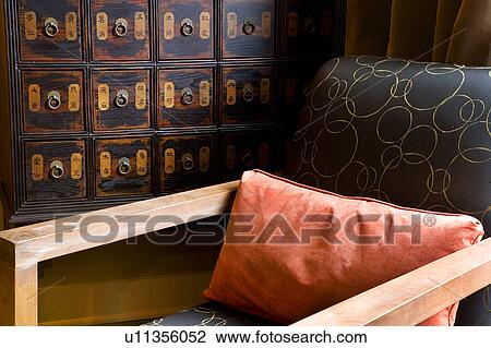 Detail of contemporary armchair and orange pillow View Large Photo Image Stock Image - Detail of contemporary armchair and orange pillow. Fotosearch