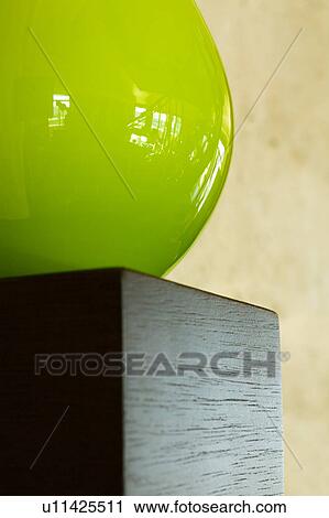 Detail of green orb on wood shelf View Large Photo Image Stock Image - Detail of green orb on wood shelf. Fotosearch