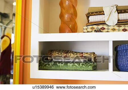 Fabrics in cubby holes in work space View Large Photo Image Stock Photograph - Fabrics in cubby holes in work space. Fotosearch