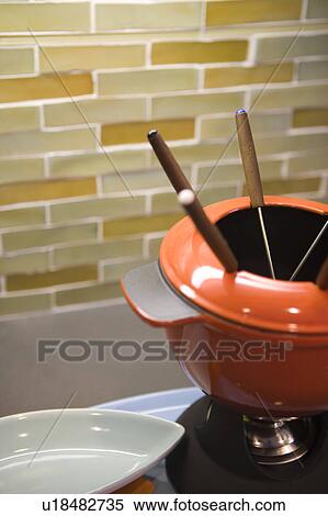 Fondue set on kitchen counter View Large Photo Image Stock Photography - Fondue set on kitchen counter. Fotosearch