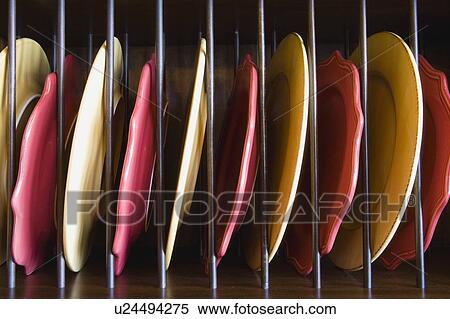 Plate Rack with Red and Yellow Plates View Large Photo Image Stock Photography - Plate Rack with Red and Yellow Plates. Fotosearch