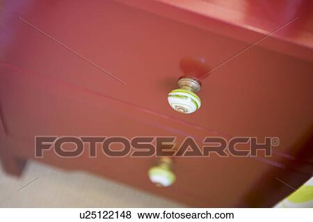 Stock Photo - Red dresser drawers, high angle. Fotosearch