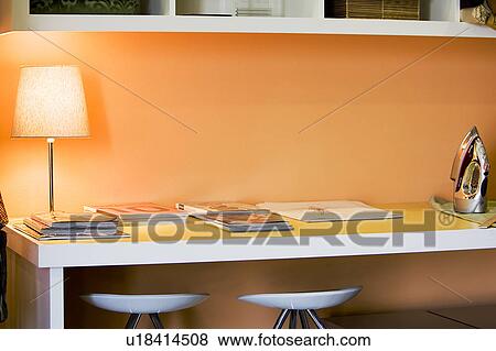 Work desk with orange walls View Large Photo Image Stock Photo - Work desk with orange walls. Fotosearch