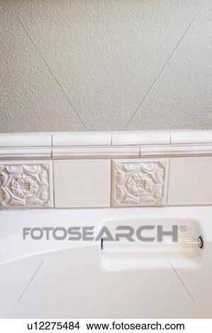 Picture - Bathtub Handle and Tile. Fotosearch
