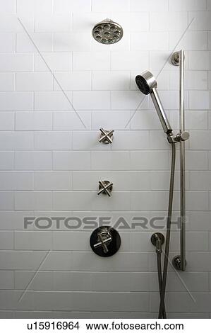 Picture - Contemporary Shower Head in White Tile Shower. Fotosearch