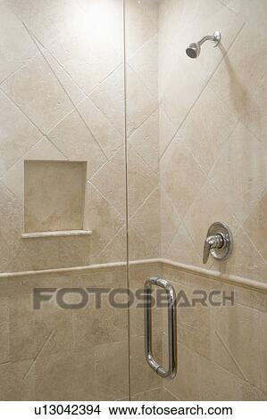 Picture - Detail of stone shower with glass door. Fotosearch
