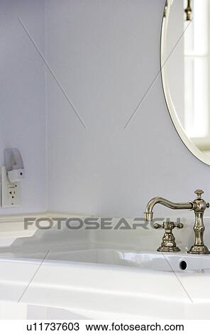 Stock Image - Elegant Bathroom with Vintage Faucet and Oval Mirror. Fotosearch
