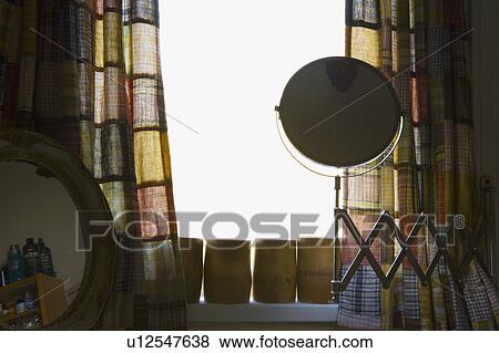 Stock Photo - Magnifying Vanity Mirror and Colorful Curtains. Fotosearch