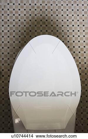 Straight down shot of a toilet with the seat down View Large Photo Image Picture - Straight down shot of a toilet with the seat down. Fotosearch