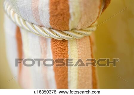 Stock Photograph - Striped ornage and white towel. Fotosearch