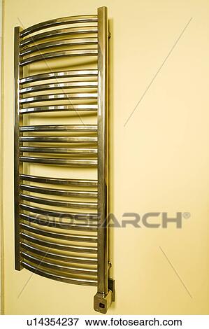 Stock Photo - Towel Warmer on Wall. Fotosearch