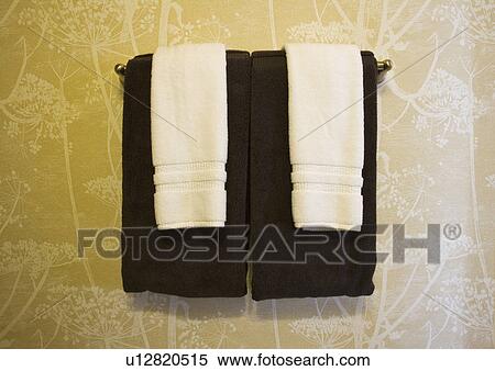 Towels Hanging in Front of Contemporary Yellow Wallpaper View Large Photo Image Stock Photography - Towels Hanging in Front of Contemporary Yellow Wallpaper. Fotosearch