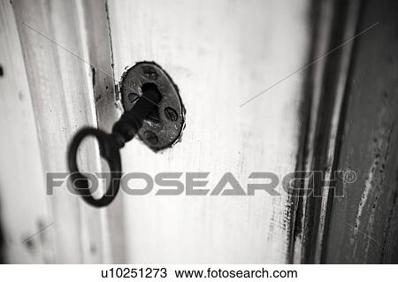 Black and white image of aged key in keyhole. View Large Photo Image Stock Image - Black and white image of aged key in keyhole.. Fotosearch