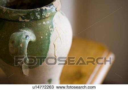 Stock Image - Detail of clay pot handle. Fotosearch