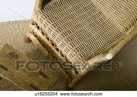 High perspective of whicker chair on carpet. View Large Photo Image Picture - High perspective of whicker chair on carpet.. Fotosearch