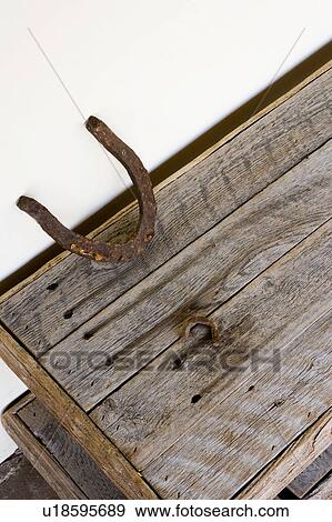 Stock Photo - Wood Table and Rusted Horshoe. Fotosearch