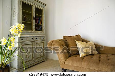Stock Photography - Brown Chase Lounge and Green Armoire. Fotosearch