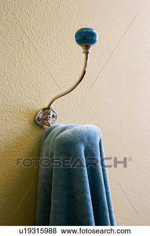 Detail of decorative wall hook with blue garment. View Large Photo Image Stock Photo - Detail of decorative wall hook with blue garment.. Fotosearch