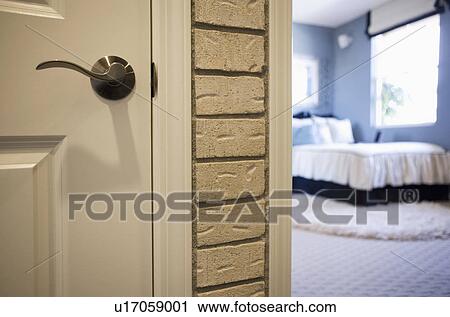 Detail of door knob with bedroom in the background View Large Photo Image Stock Image - Detail of door knob with bedroom in the background. Fotosearch