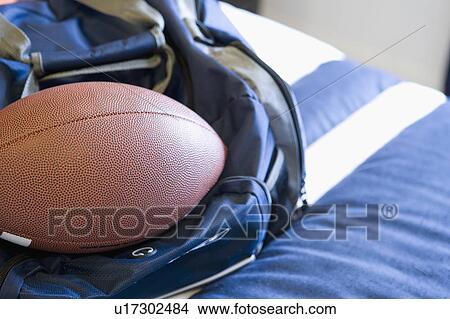 Picture - Detail of gym bag and football. Fotosearch