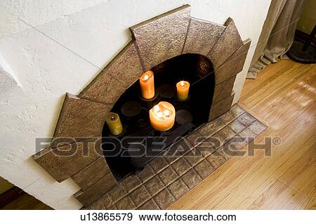 Lit Candles In Fireplace Stock Photo U13865579 Fotosearch