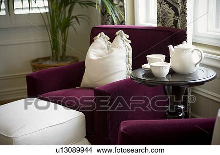 Vignette of purple chair with white pillow and tea set View Large Photo Image Picture - Vignette of purple chair with white pillow and tea set. Fotosearch