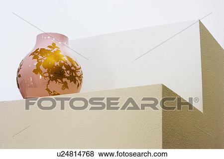 Stock Photo - Contemporary Vase Sitting on Built In Architectural Display. Fotosearch