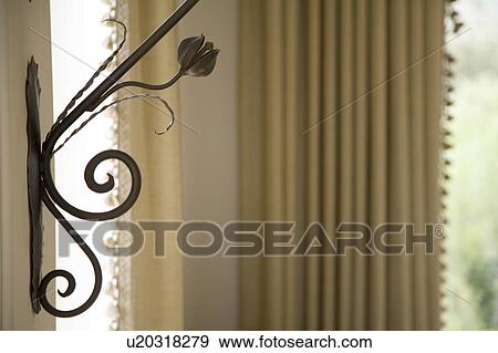 Stock Photo - Detail of decorative wrought iron on wall.. Fotosearch