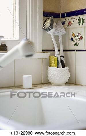 Stock Image - Detail of dish cleaning items.. Fotosearch
