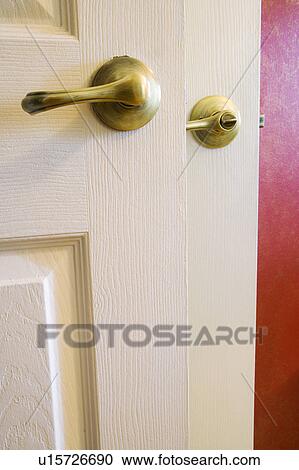 Detail of two door handles and red wall. View Large Photo Image Stock Image - Detail of two door handles and red wall.. Fotosearch