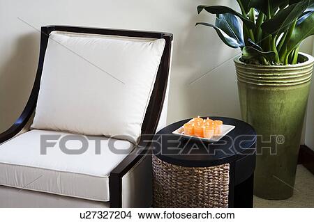White Armchair and Orange Candles View Large Photo Image Picture - White Armchair and Orange Candles. Fotosearch