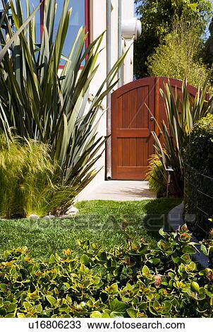 Stock Image - Wood Front Gate to California Home. Fotosearch