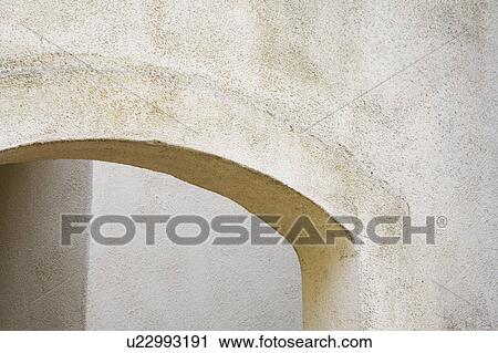 Arched exterior stucco doorway View Large Photo Image Stock Image - Arched exterior stucco doorway. Fotosearch