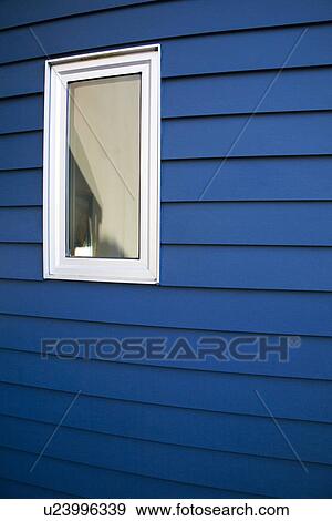 Stock Photo - Exterior blue siding and window. Fotosearch