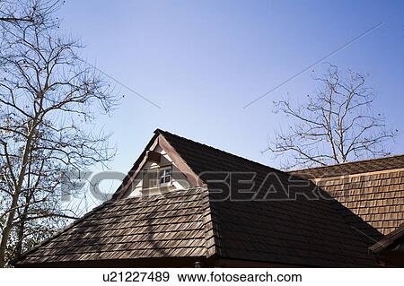 Stock Photo - Small Gable with Window and Wood Shingle Roof. Fotosearch