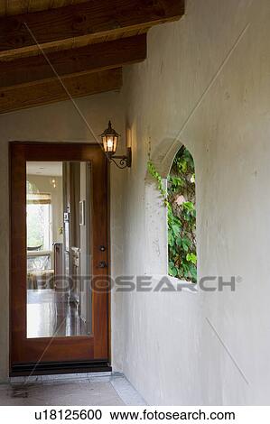 Vignette of hallway with wood door and arch View Large Photo Image Stock Image - Vignette of hallway with wood door and arch. Fotosearch