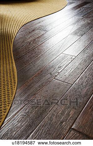 Dark hardwood floor and carpet View Large Photo Image Stock Photo - Dark hardwood floor and carpet. Fotosearch