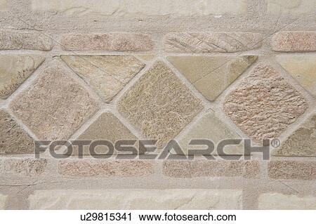 Stock Image - Detail of stone tiles in a shower, close up. Fotosearch