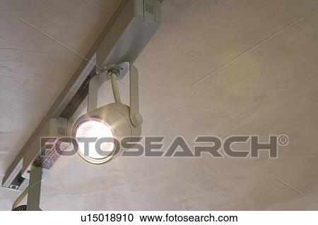 Stock Image - Detail of track lighting, close up. Fotosearch