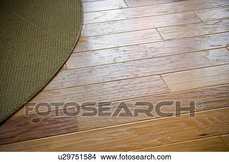 Rug on hardwood floor View Large Photo Image Picture - Rug on hardwood floor. Fotosearch