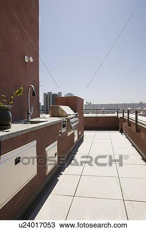 BBQ area on patio with city view in background. View Large Photo Image Stock Image - BBQ area on patio with city view in background.. Fotosearch
