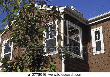Stock Photograph - Exterior Detail of Brown American Home. Fotosearch