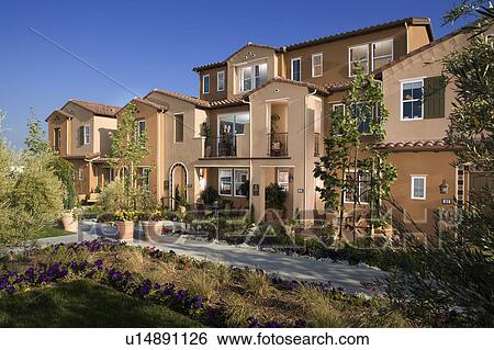 Exterior of attached homes during the afternoon View Large Photo Image Stock Photograph - Exterior of attached homes during the afternoon. Fotosearch