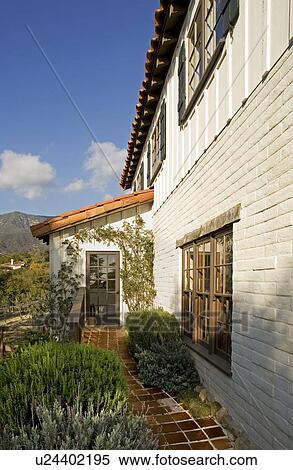 Stock Photography - Exterior of Spanish Style Home and Landscape. Fotosearch